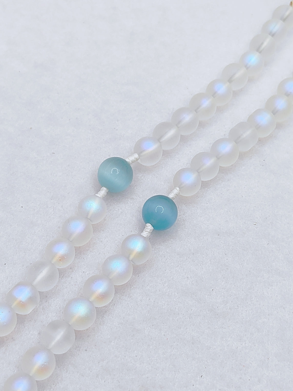 Our Lady of Lourdes White Glass & Blue Cat Eye Rosary